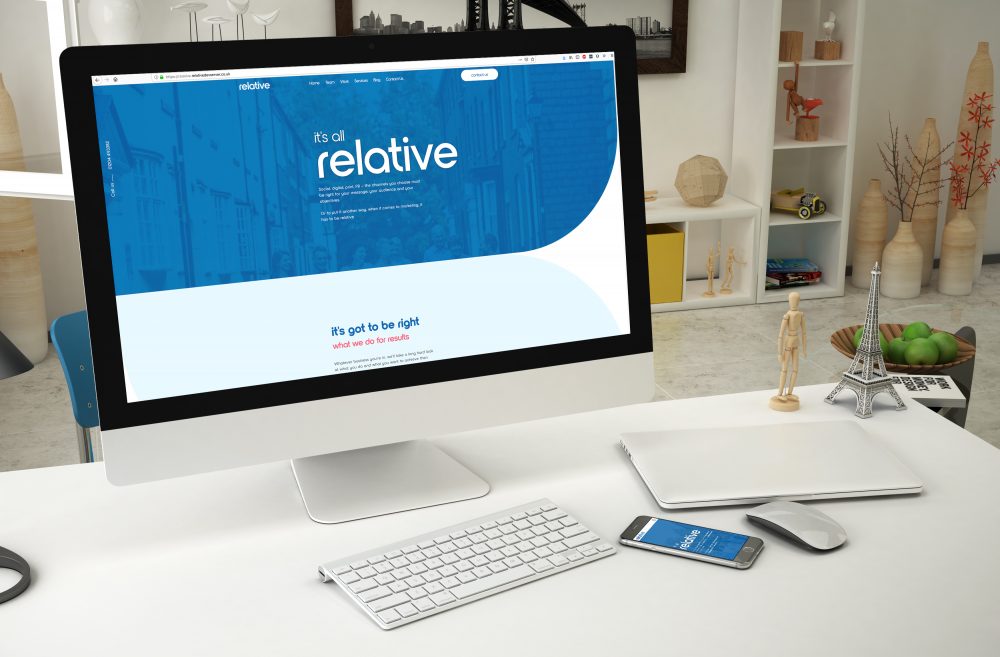 relative marketing website on an apple mac in a living room